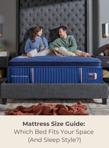 Couple in Stearns and Foster Bed. mattress size guide blog.